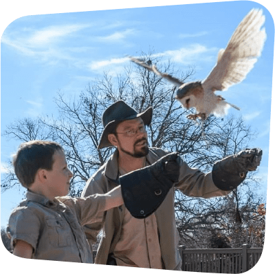 Kevin Gaines with boy and owl