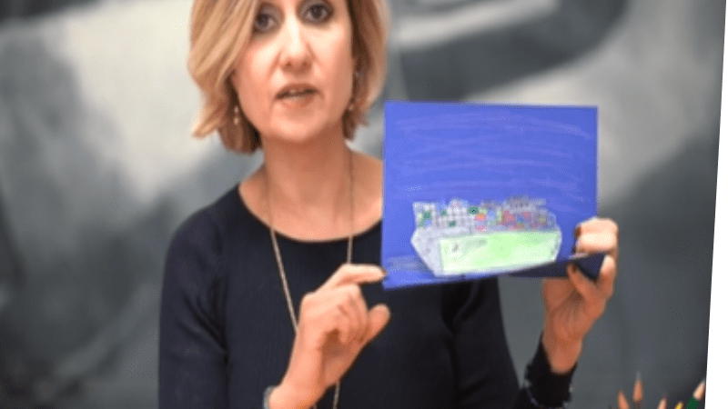 Dawn Daniels displaying a pop up with a ship on it