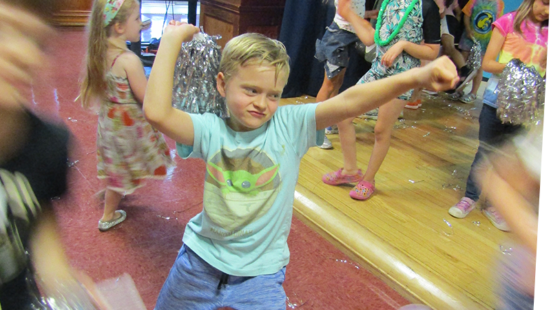 Boy dancing in Portia's Playhouse