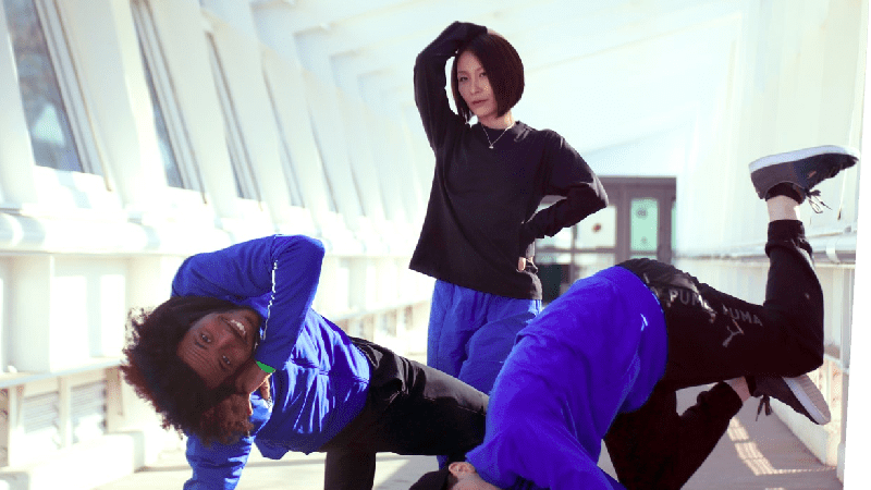 Three dancers in hip hop poses