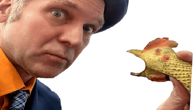 Rich the Juggler reacting to a rubber chicken with surprise and uncertainty