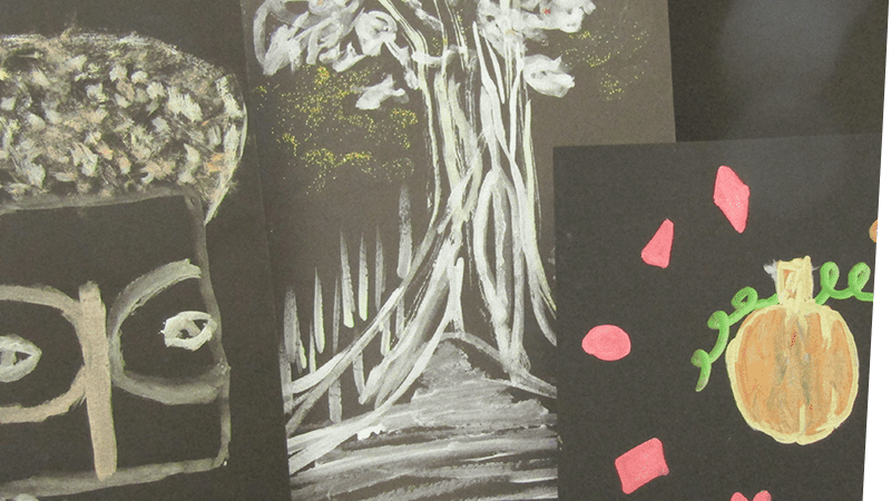 Paintings of an African mask, a tree and a pumpkin made from metallic paints on black paper