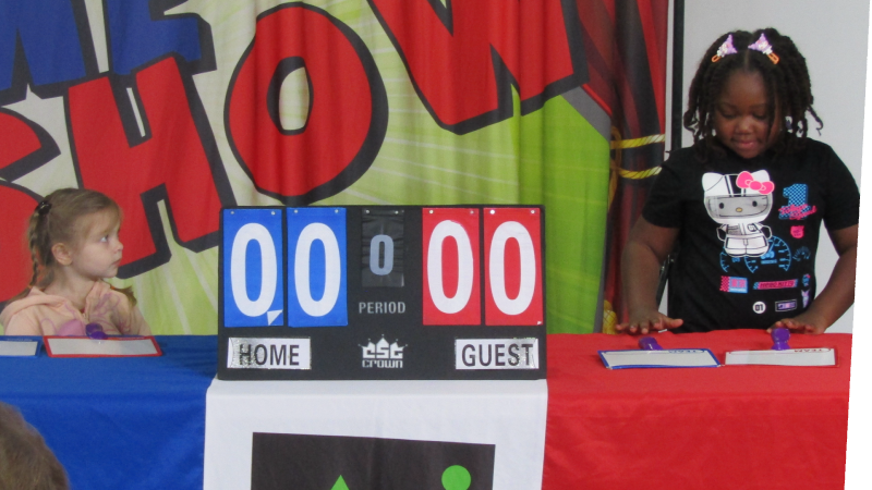 two girls playing mainstays game show in gallery