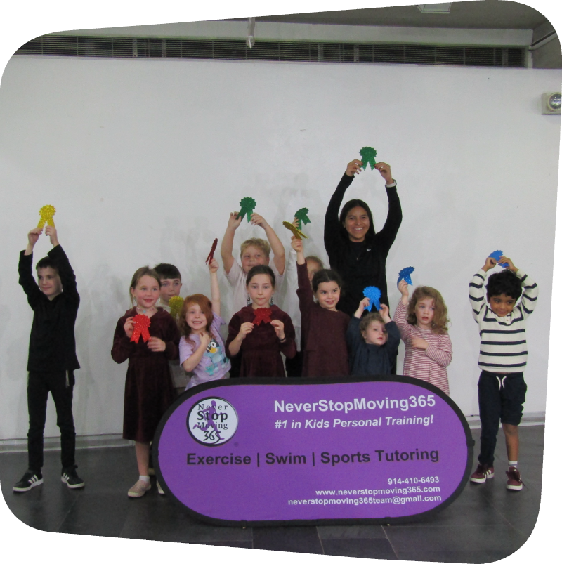 kids in the gallery holding up awards after never stop moving 365 event in gallery
